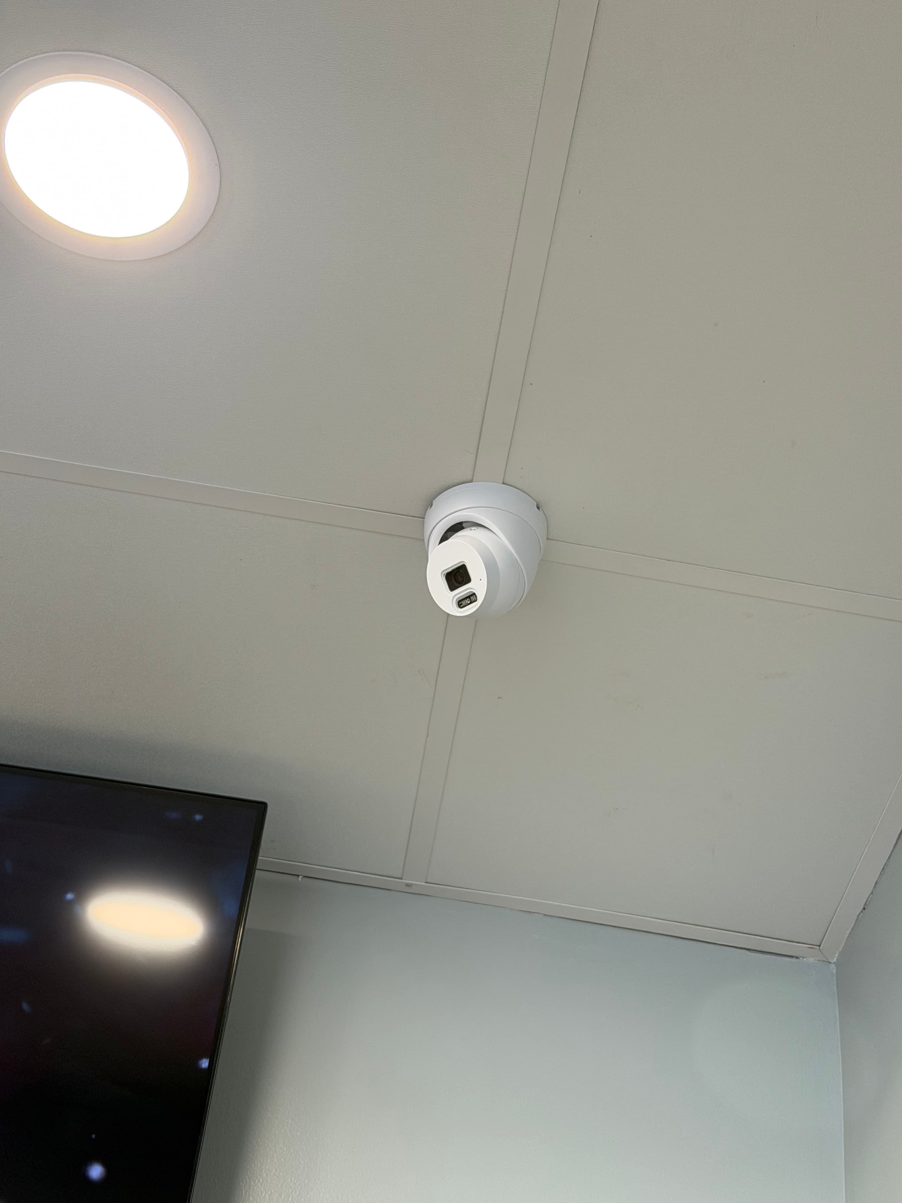 Overhead surveillance camera in restaurant interior