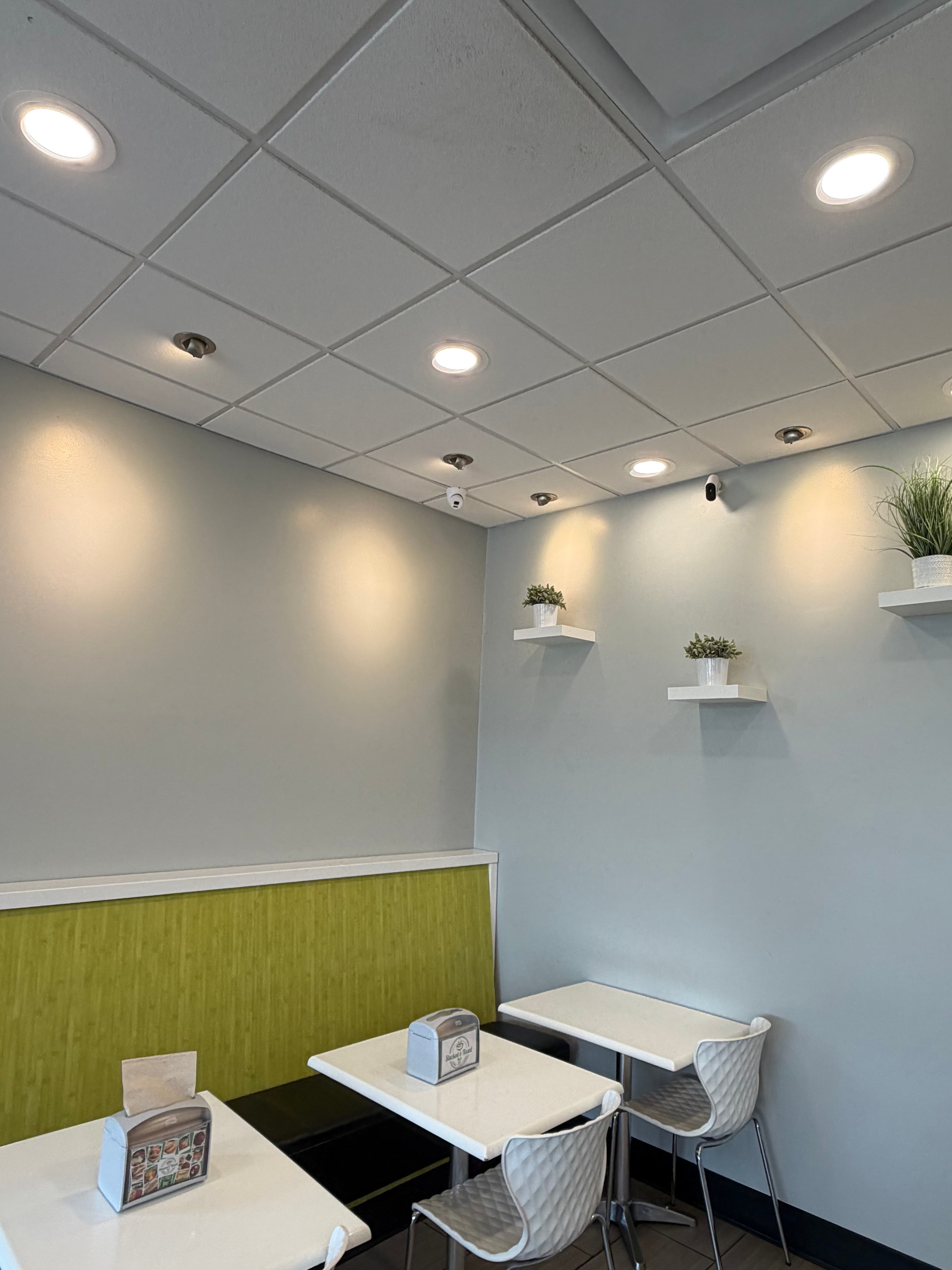 Ceiling-mounted security camera with dining room view